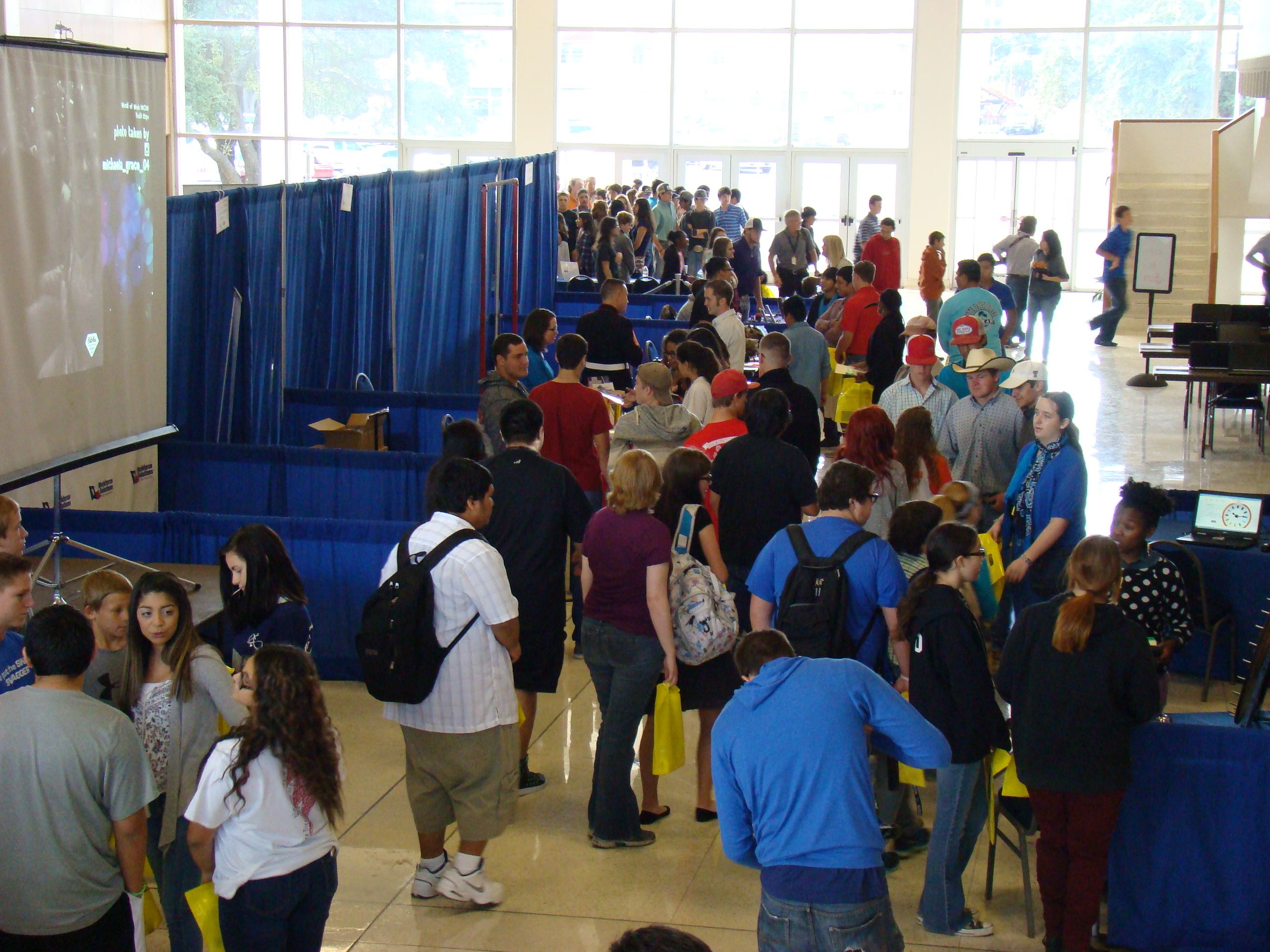 Students visiting foyer exhibitors